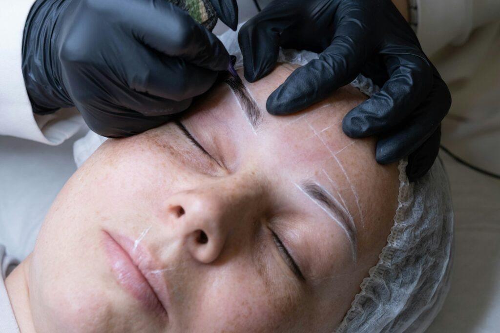 close up reveals the precision of the microblading needle delicately crafting each hair stroke